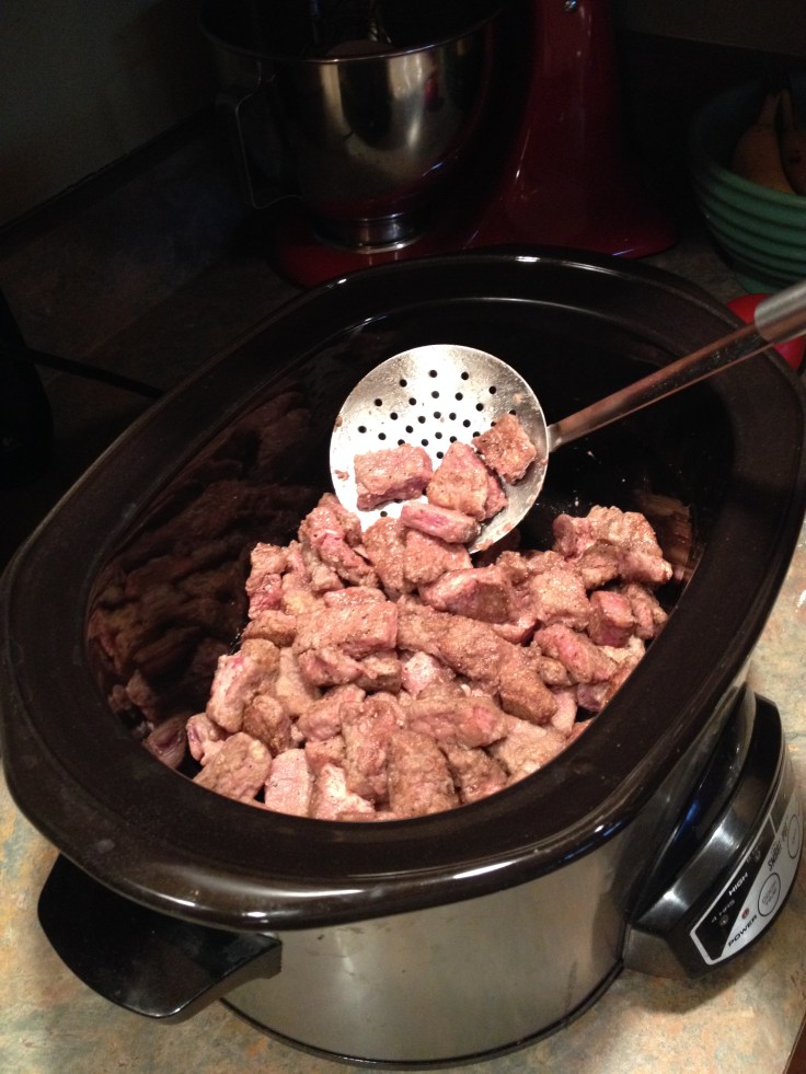 adding the browned beef to the slow cooker in the morning.